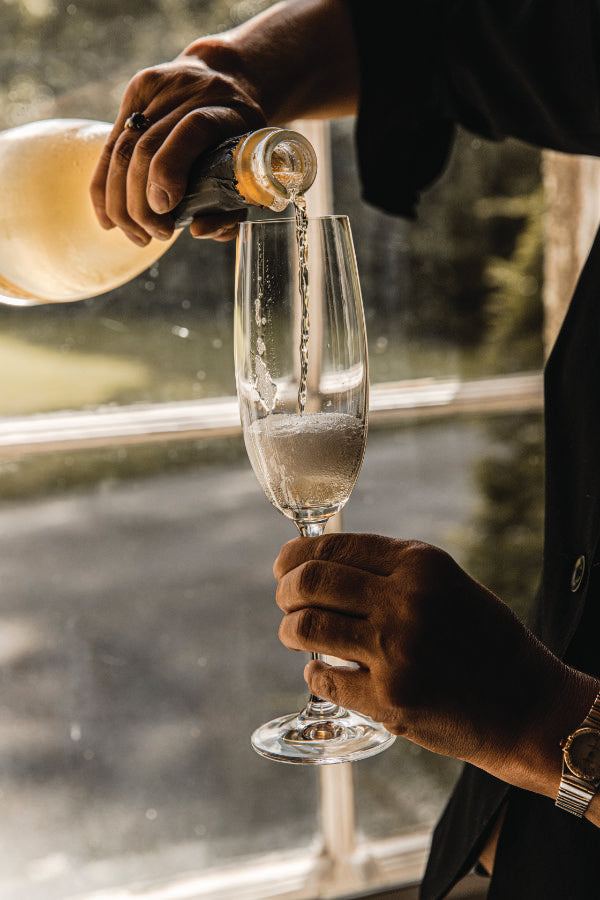 Floreat Wine being poured into champagne flute glass. 